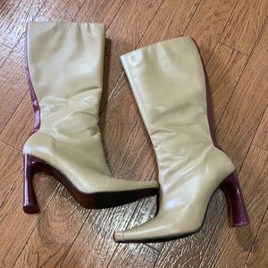 Tan boots with maroon stripe detail and heel